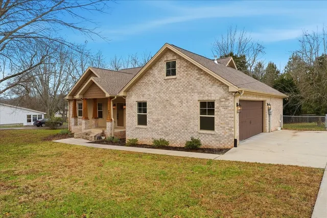 a front view of a house with yard