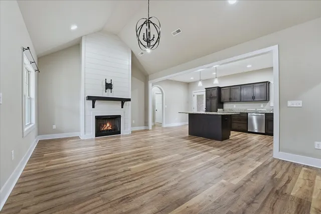 a view of kitchen and a wooden floor