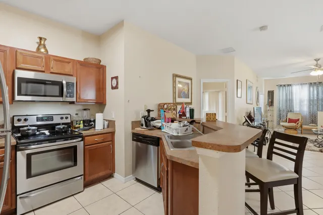 a kitchen with a stove a sink and a refrigerator