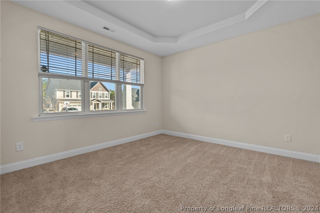 560 Angel Oak Drive Bunnlevel, NC 28323 - Photo 11 of 49 an empty room with windows