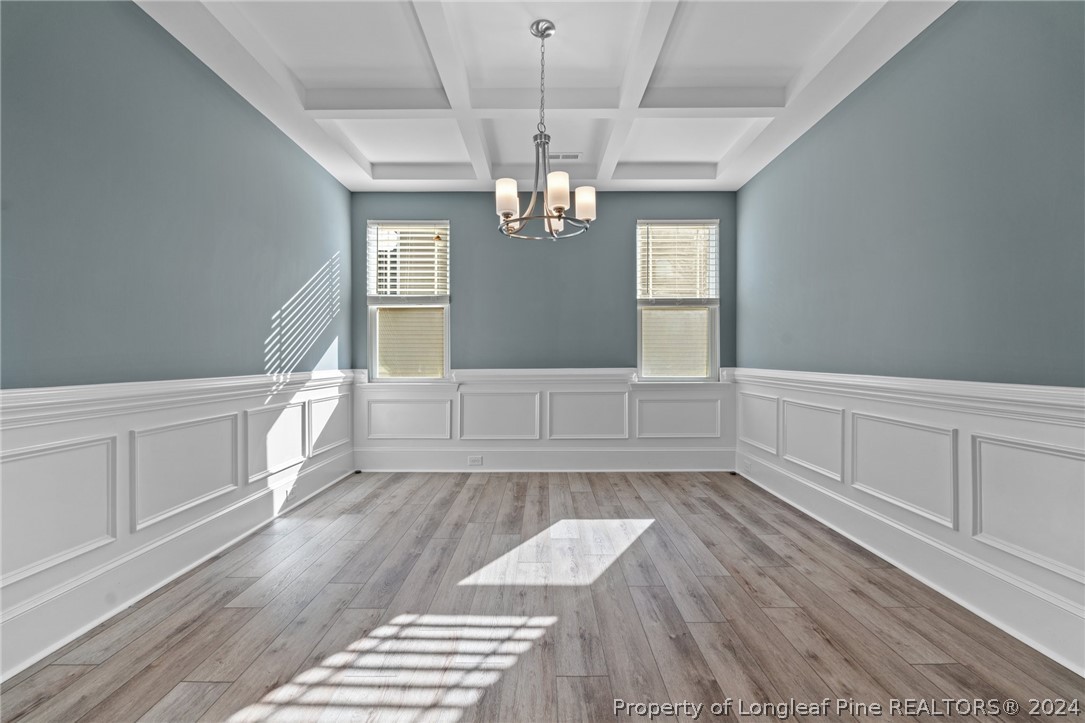 560 Angel Oak Drive Bunnlevel, NC 28323 - Photo 12 of 49 wooden floor in an empty room with a window