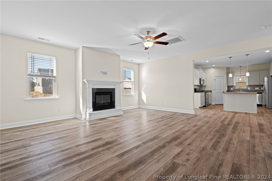 560 Angel Oak Drive Bunnlevel, NC 28323 - Photo 17 of 49 a view of a kitchen with wooden floor and a kitchen