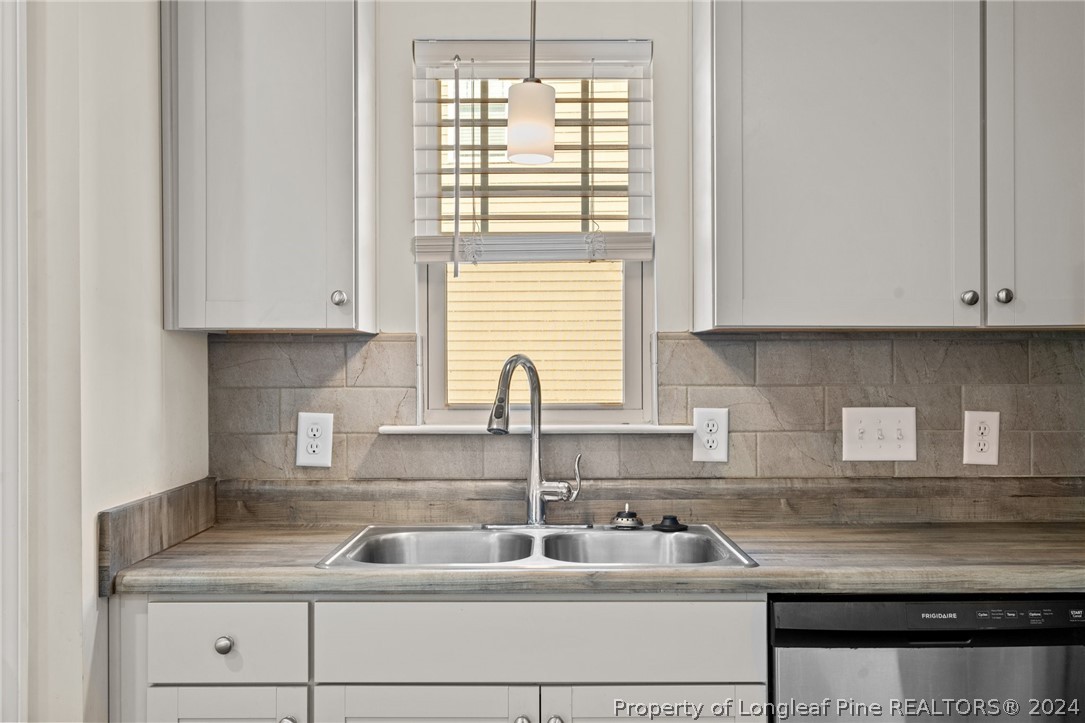 560 Angel Oak Drive Bunnlevel, NC 28323 - Photo 20 of 49 a kitchen with a sink and cabinets