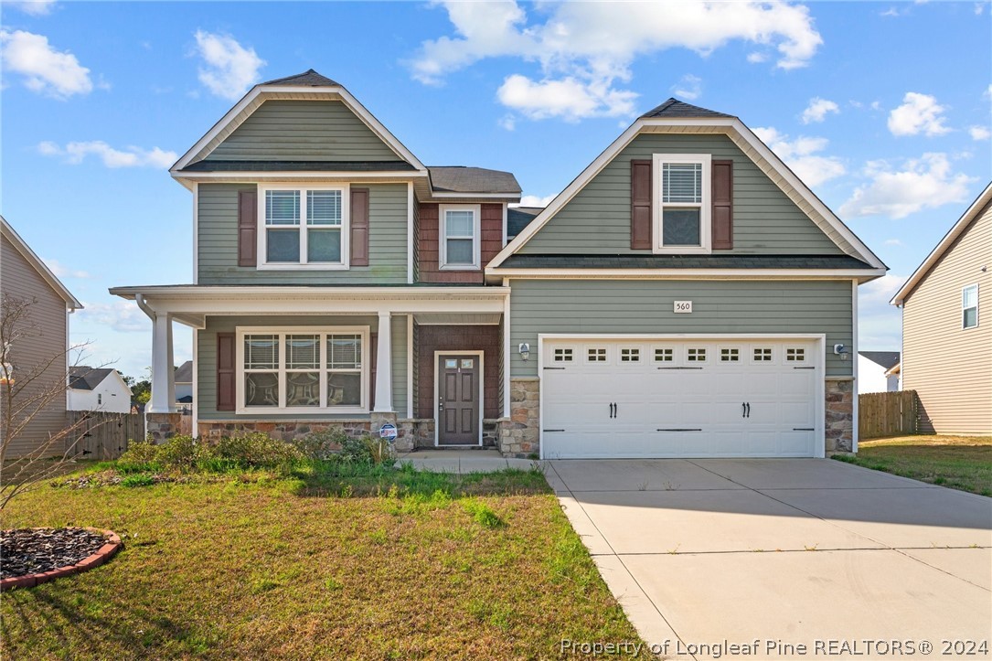 560 Angel Oak Drive Bunnlevel, NC 28323 - Photo 2 of 49 a front view of a house with a yard