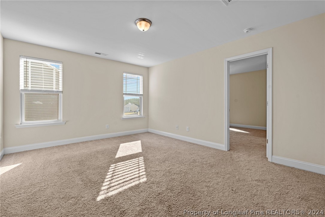 560 Angel Oak Drive Bunnlevel, NC 28323 - Photo 27 of 49 an empty room with windows