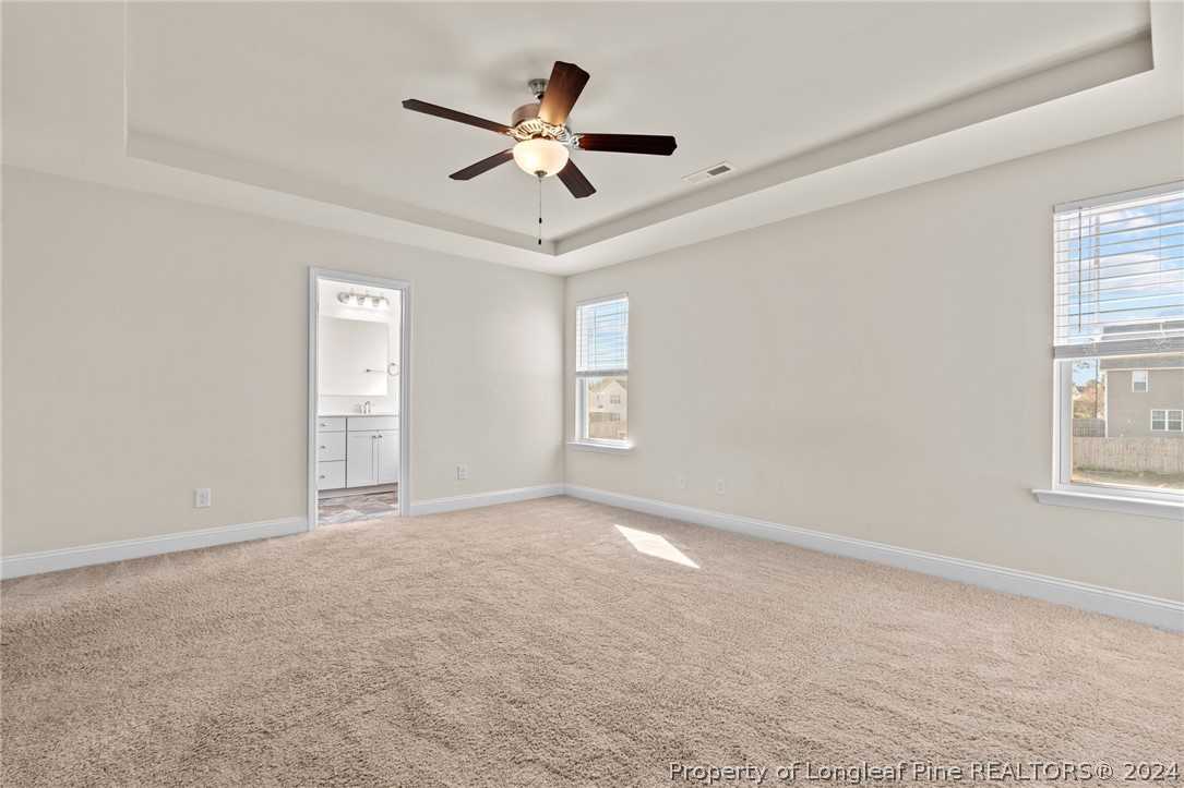 560 Angel Oak Drive Bunnlevel, NC 28323 - Photo 30 of 49 an empty room with windows and fan