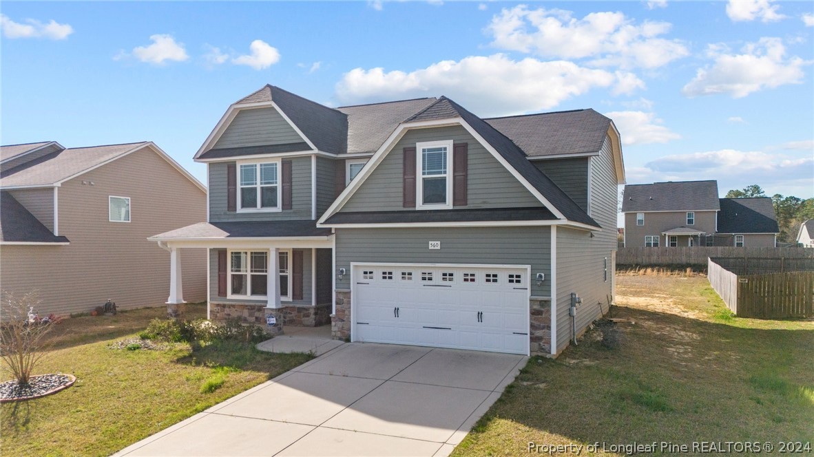 560 Angel Oak Drive Bunnlevel, NC 28323 - Photo 3 of 49 a front view of a house with a yard