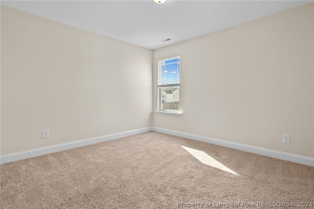 560 Angel Oak Drive Bunnlevel, NC 28323 - Photo 34 of 49 an empty room with windows