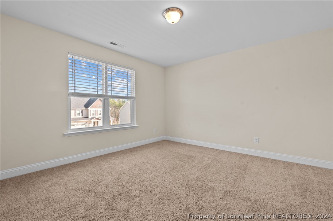 560 Angel Oak Drive Bunnlevel, NC 28323 - Photo 35 of 49 an empty room with windows