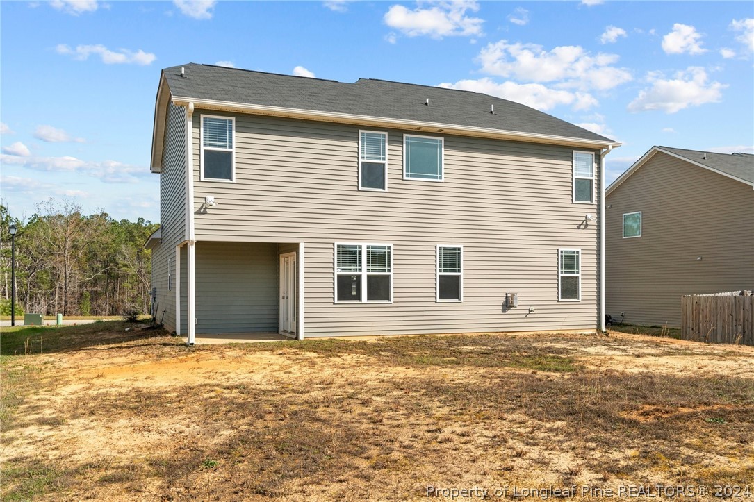 560 Angel Oak Drive Bunnlevel, NC 28323 - Photo 43 of 49 a front view of a house with a garage