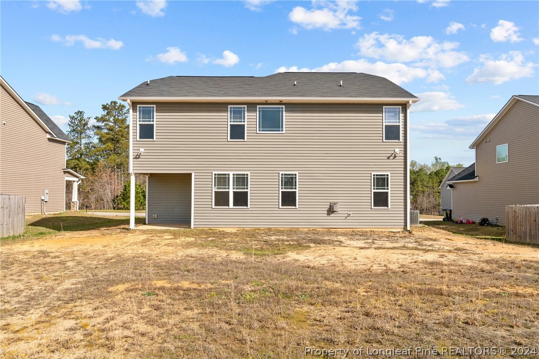 560 Angel Oak Drive Bunnlevel, NC 28323 - Photo 44 of 49 a front view of a house with a yard