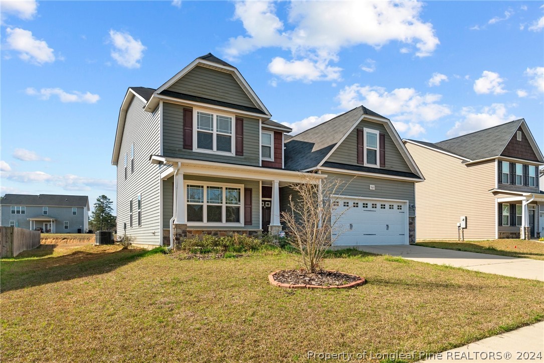 560 Angel Oak Drive Bunnlevel, NC 28323 - Photo 5 of 49 a front view of a house with a yard