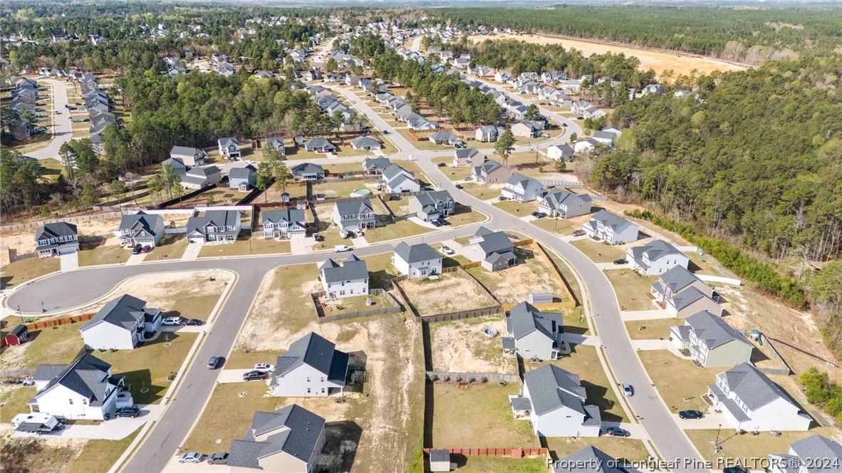 560 Angel Oak Drive Bunnlevel, NC 28323 - Photo 7 of 49 an aerial view of residential houses with outdoor space