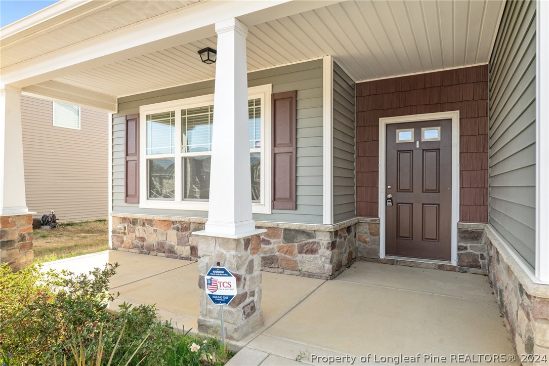 560 Angel Oak Drive Bunnlevel, NC 28323 - Photo 8 of 49 a front view of a house with a yard