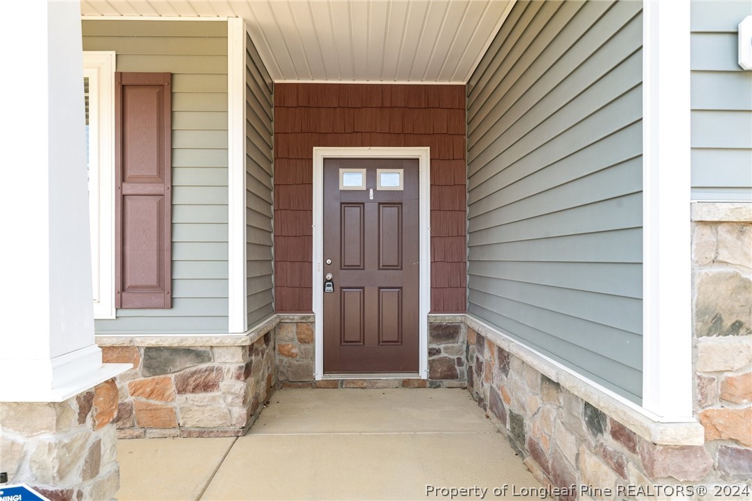 560 Angel Oak Drive Bunnlevel, NC 28323 - Photo 9 of 49 a view of front door of a house