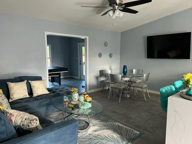 a living room with furniture and a flat screen tv