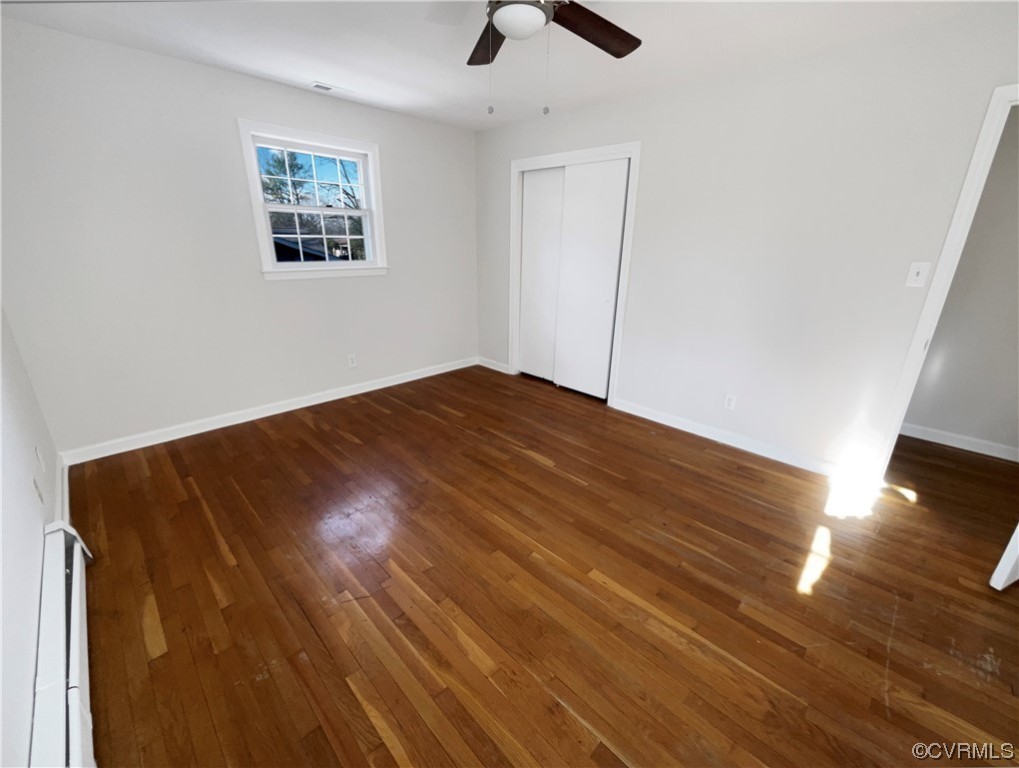 1303 Covington Road Colonial Heights, VA 23834 - Photo 13 of 15 a view of empty room with wooden floor and fan