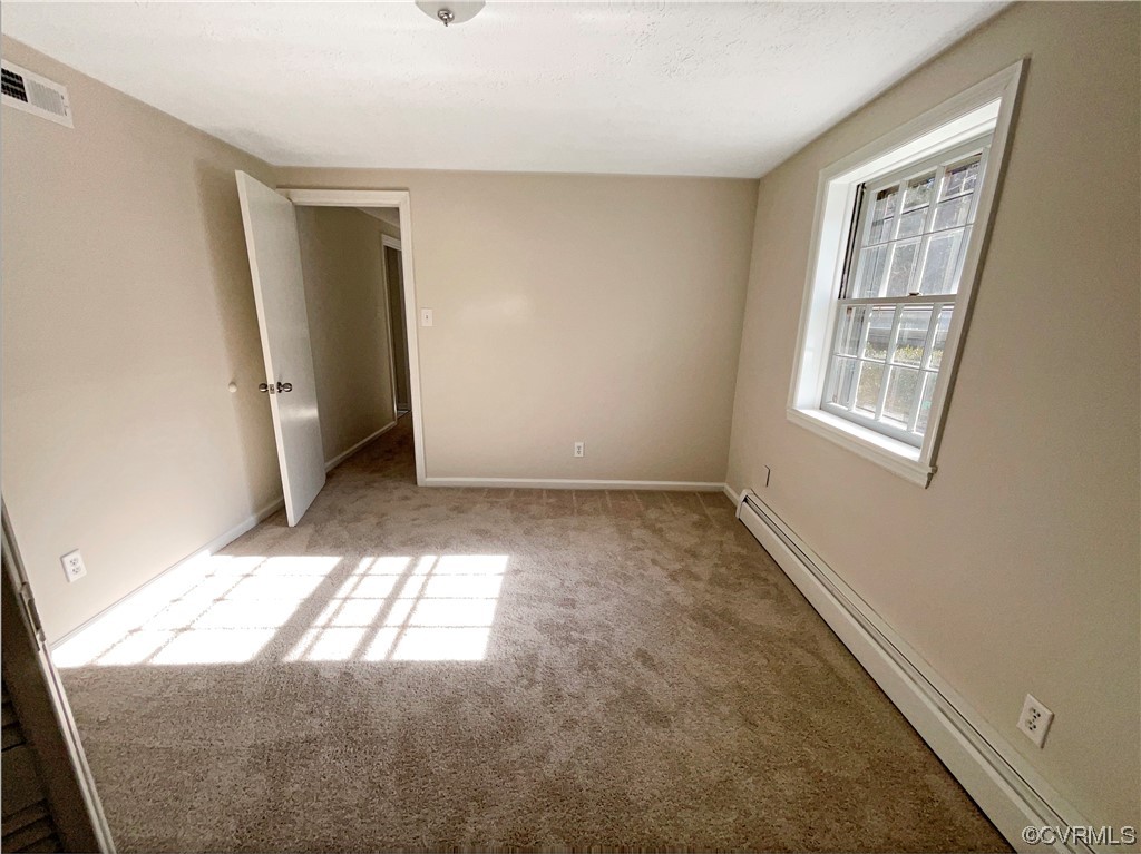 1303 Covington Road Colonial Heights, VA 23834 - Photo 4 of 15 an empty room with windows