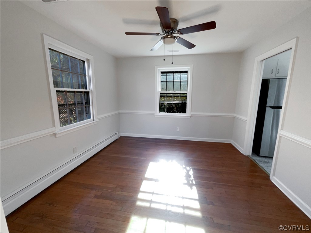 1303 Covington Road Colonial Heights, VA 23834 - Photo 8 of 15 a view of an empty room with wooden floor and a window