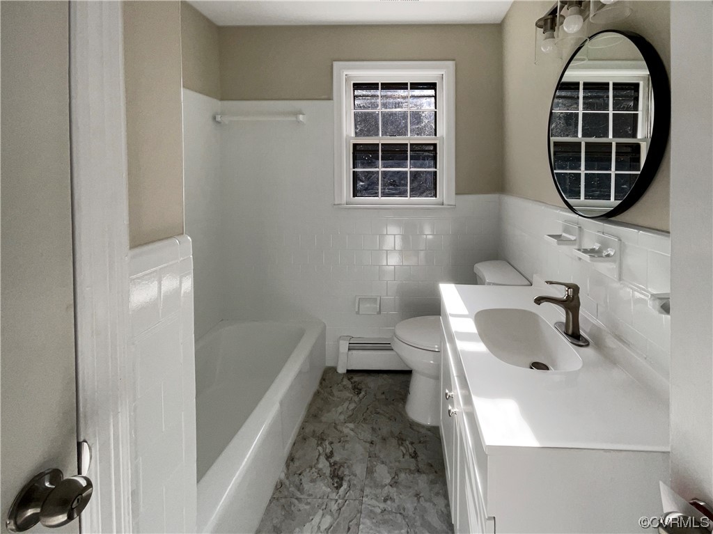 1303 Covington Road Colonial Heights, VA 23834 - Photo 10 of 15 a bathroom with a sink and a bathtub