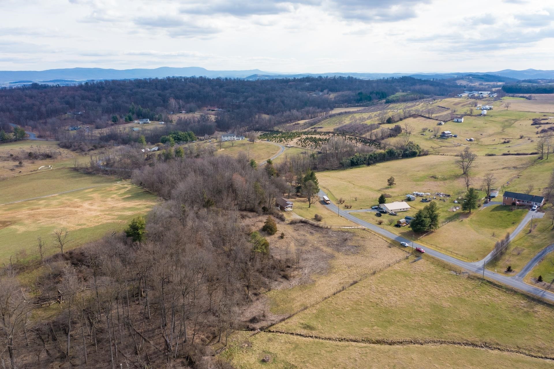 8318 Winestore Road Timberville, VA 22853 - Photo 12 of 33 a view of a lake with mountains in the background