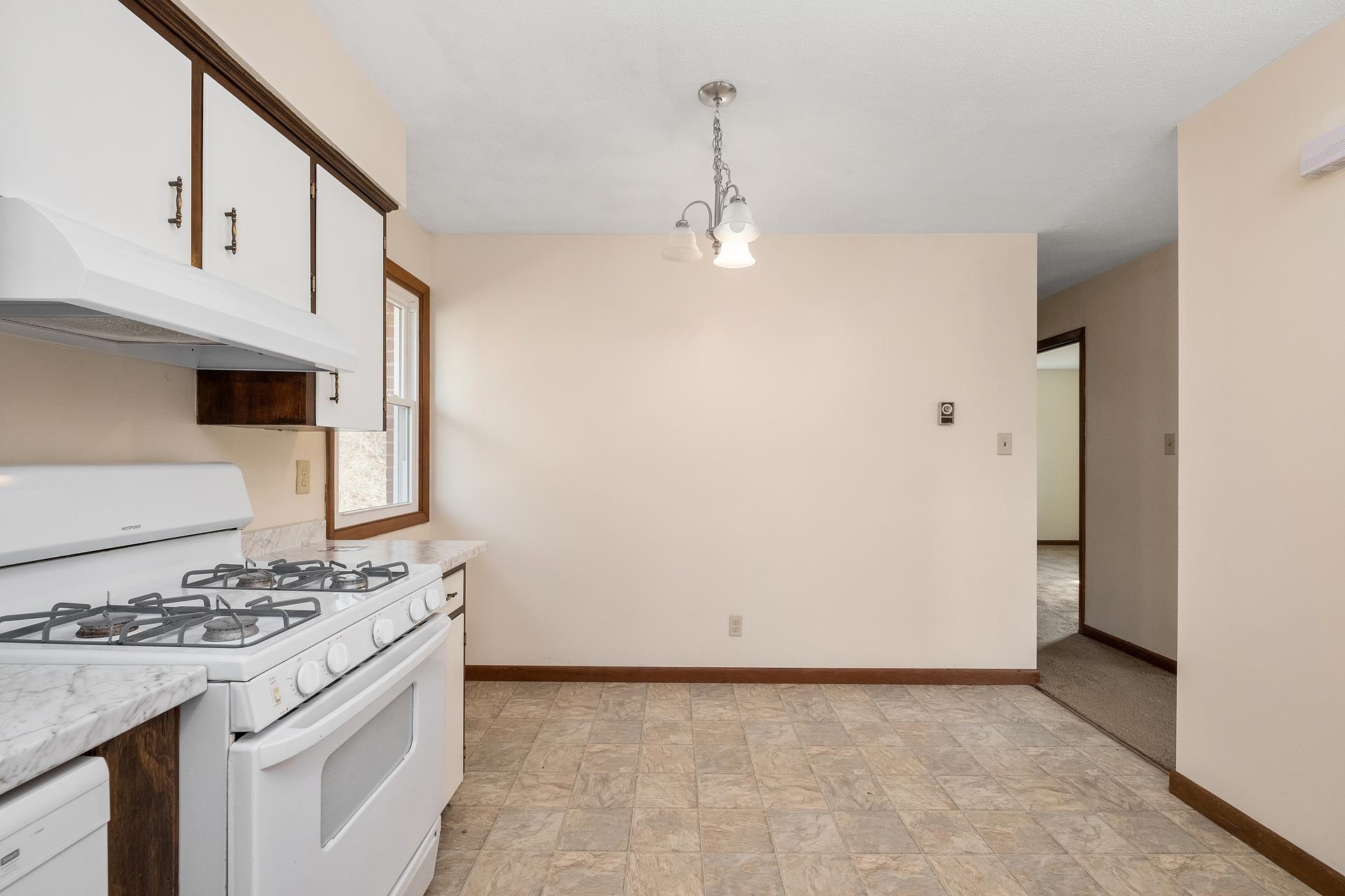 8318 Winestore Road Timberville, VA 22853 - Photo 16 of 33 a kitchen with a stove a sink and a refrigerator