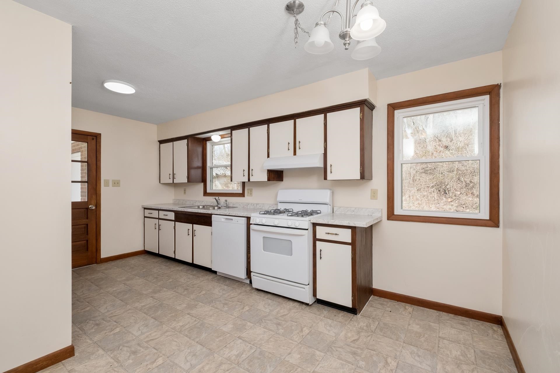 8318 Winestore Road Timberville, VA 22853 - Photo 18 of 33 a large white kitchen with a large window