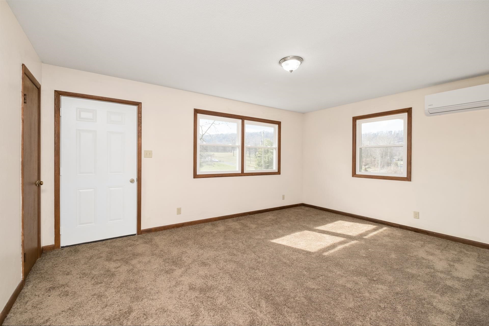 8318 Winestore Road Timberville, VA 22853 - Photo 20 of 33 an empty room with windows and closet