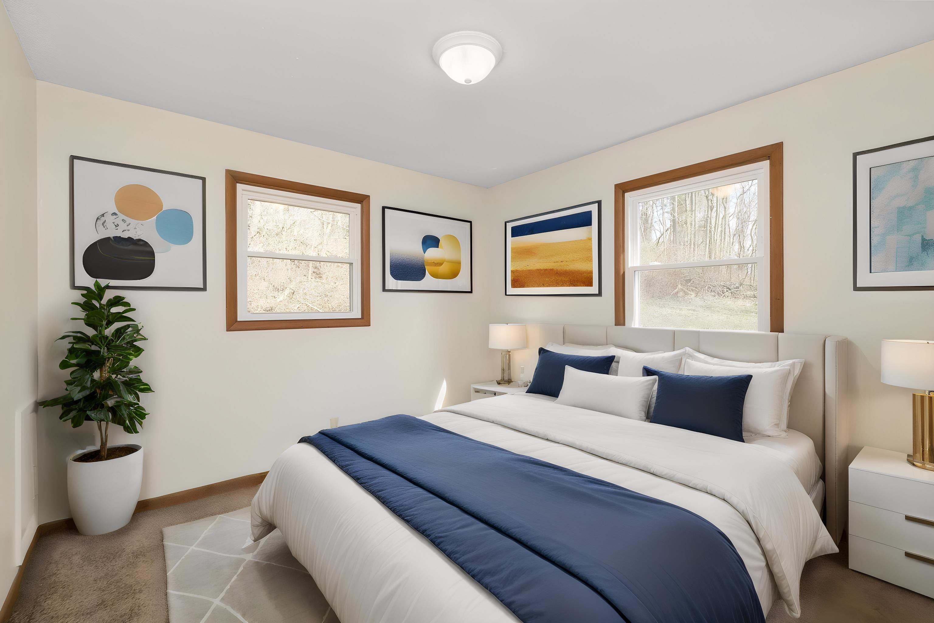 8318 Winestore Road Timberville, VA 22853 - Photo 28 of 33 a bedroom with a bed and a potted plant