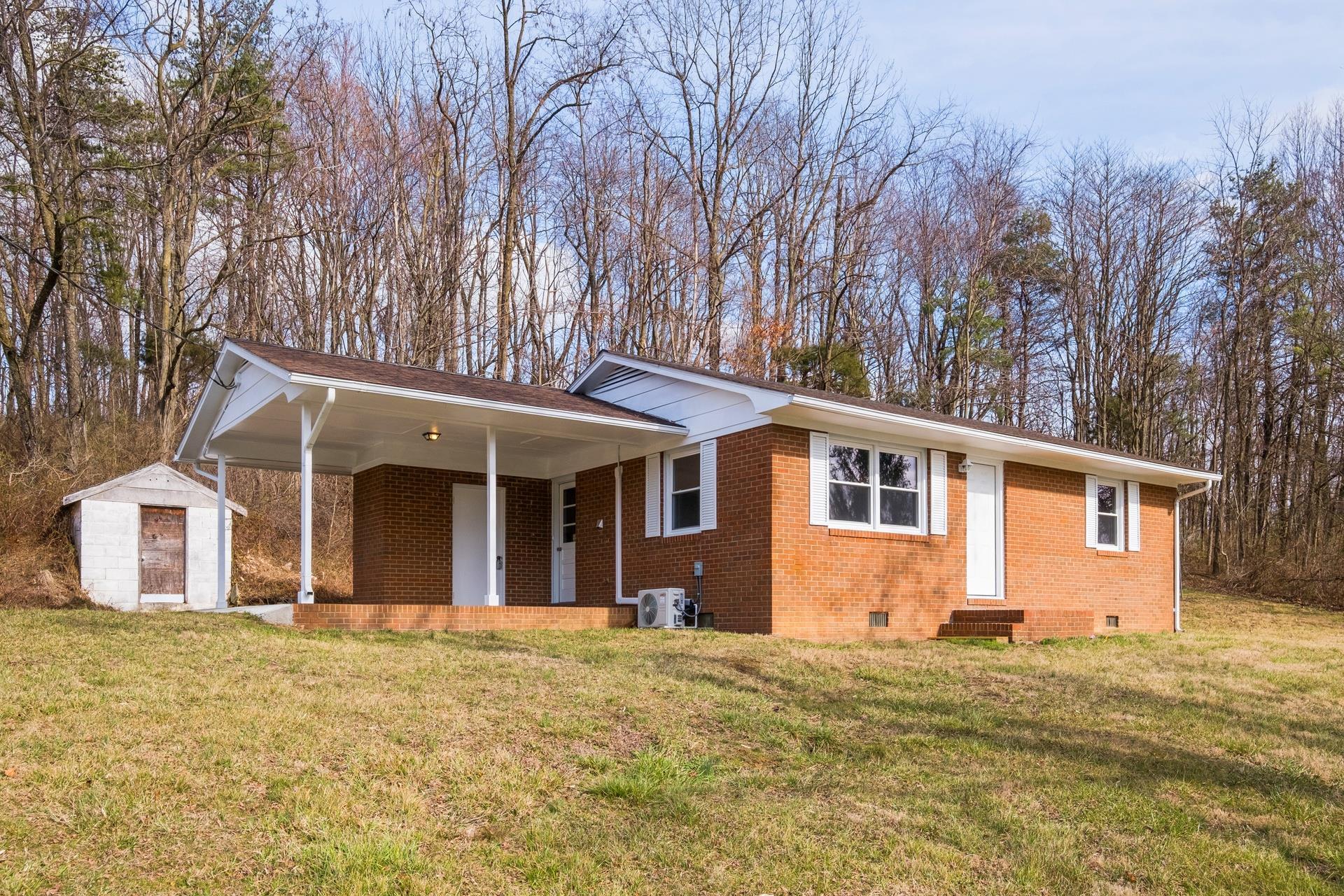 8318 Winestore Road Timberville, VA 22853 - Photo 3 of 33 a front view of a house with a garden