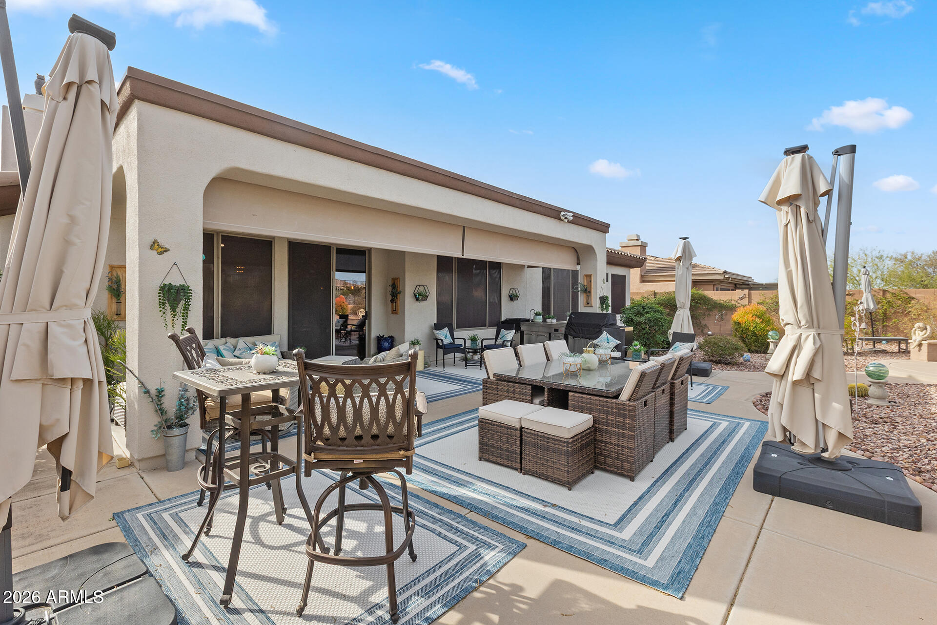 41712 North Golf Crest Road Anthem, AZ 85086 - Photo 26 of 39 a view of a patio with couches table and chairs