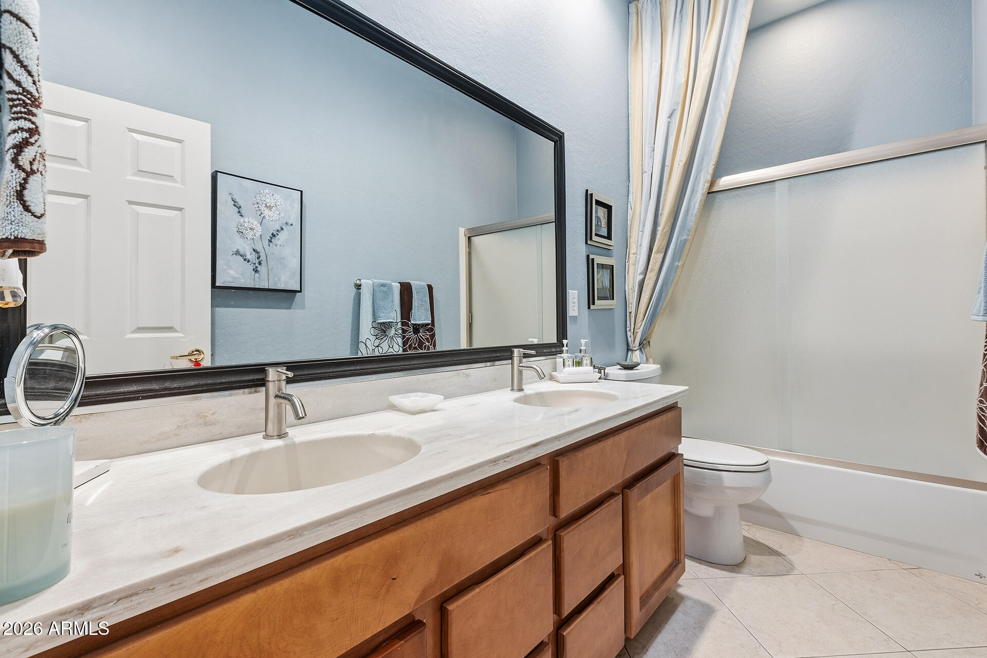 41712 North Golf Crest Road Anthem, AZ 85086 - Photo 3 of 39 a bathroom with a granite countertop sink toilet and mirror