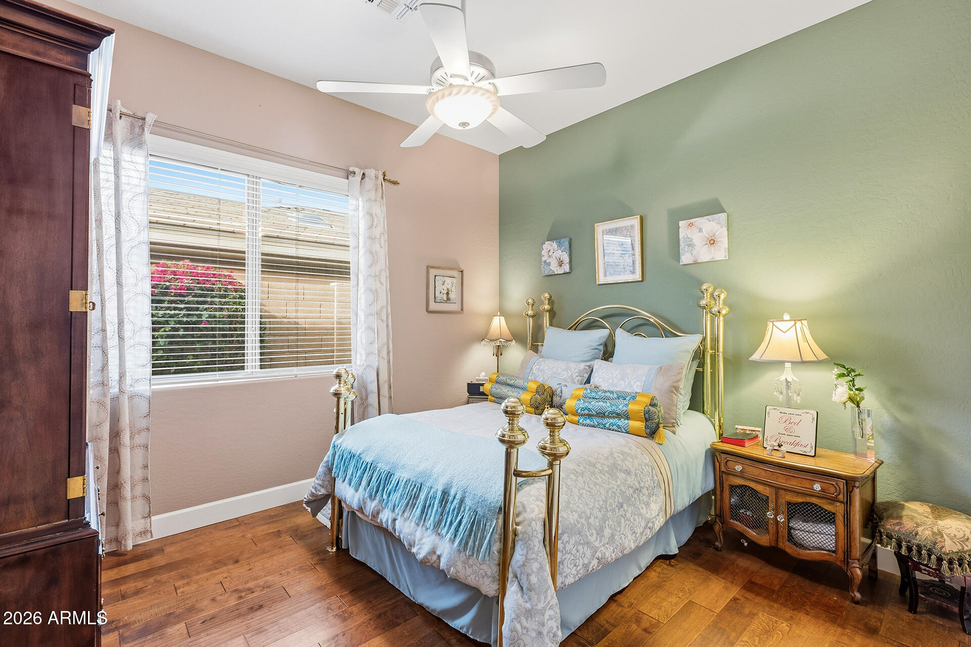 41712 North Golf Crest Road Anthem, AZ 85086 - Photo 5 of 39 a bedroom with a bed and a chandelier