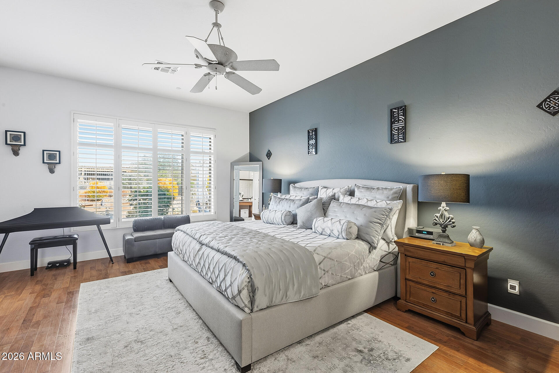 41712 North Golf Crest Road Anthem, AZ 85086 - Photo 6 of 39 a bedroom with a bed and a couch