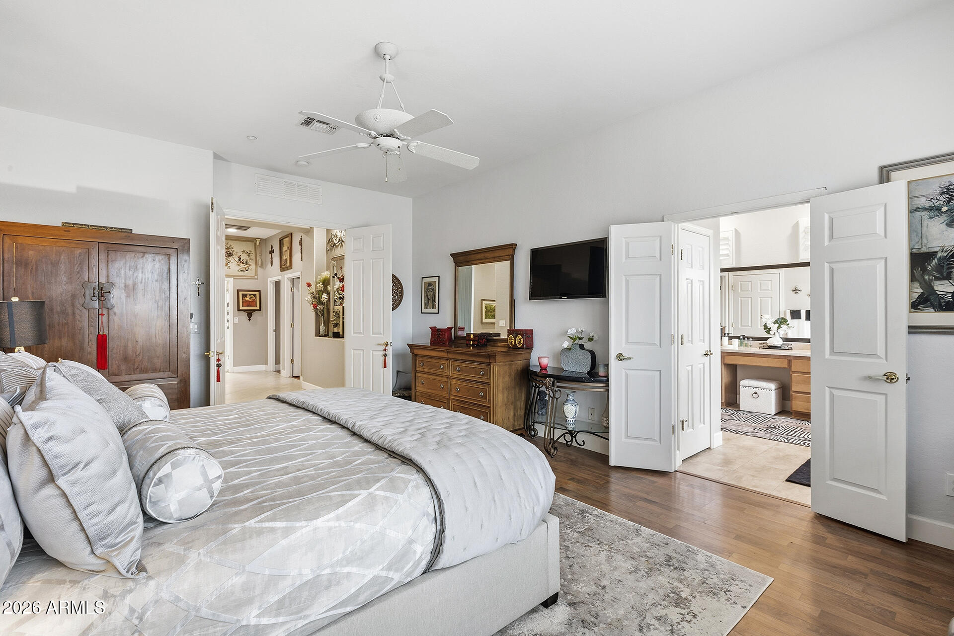 41712 North Golf Crest Road Anthem, AZ 85086 - Photo 7 of 39 a bedroom with a bed and flat screen tv