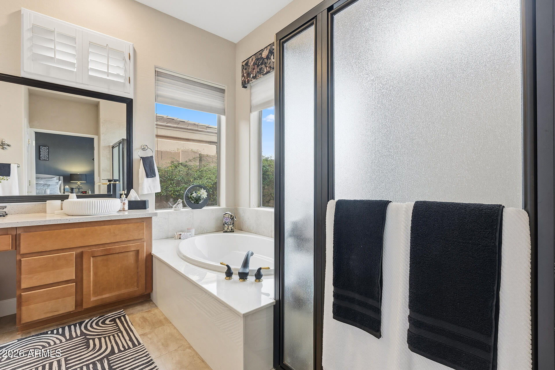 41712 North Golf Crest Road Anthem, AZ 85086 - Photo 8 of 39 a bathroom with a bathtub and a sink