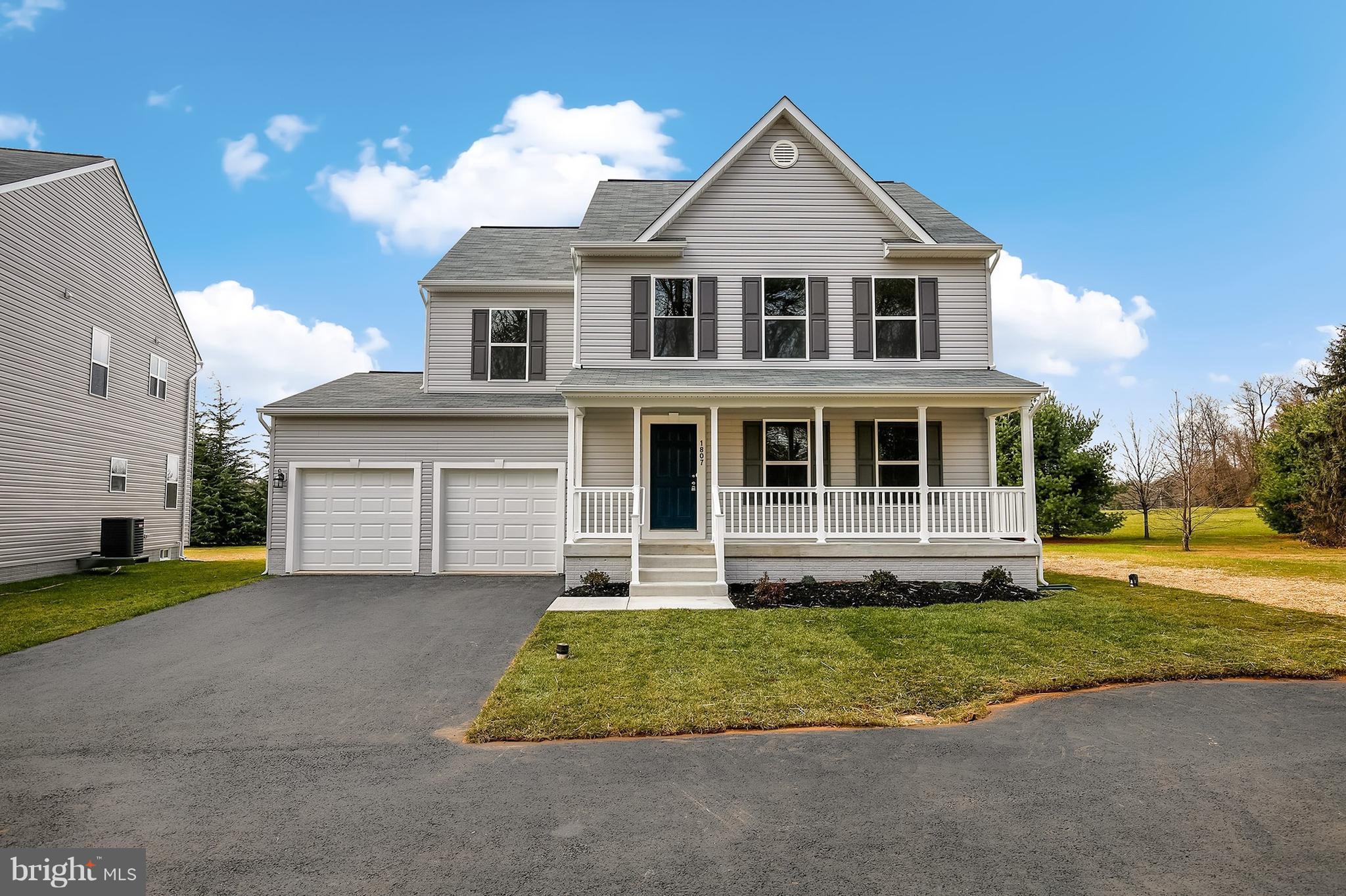 8035 Clark Station Road Severn, MD 21144 - Photo 1 of 24 a front view of a house with a yard and garage