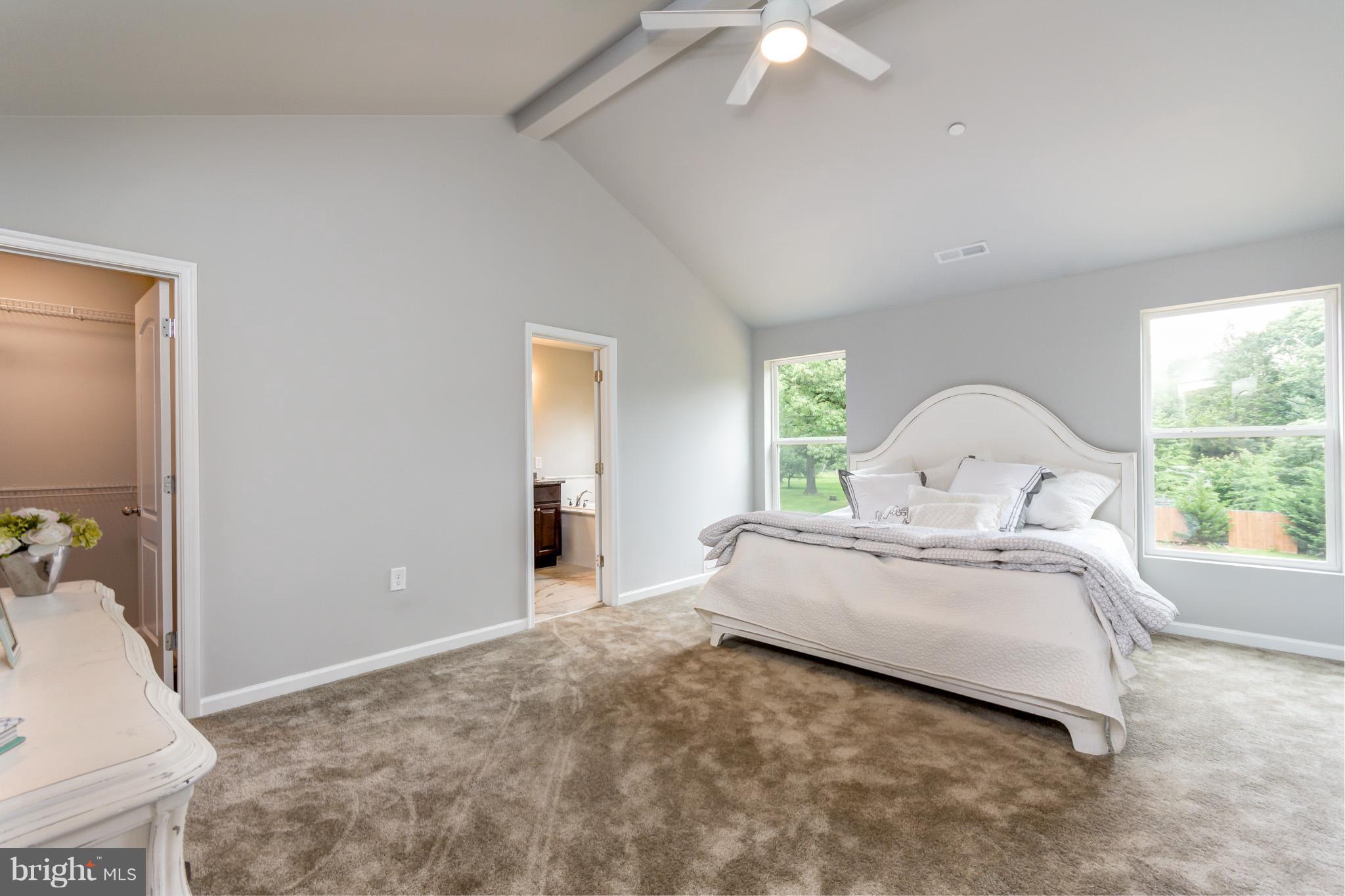 8035 Clark Station Road Severn, MD 21144 - Photo 11 of 24 a bed room with a bed and a large window