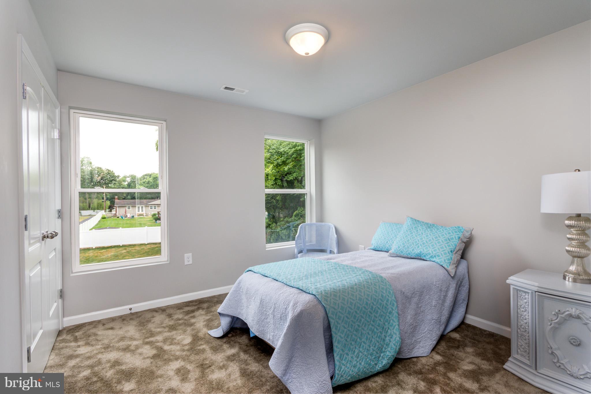 8035 Clark Station Road Severn, MD 21144 - Photo 20 of 24 a bedroom with a bed and a window