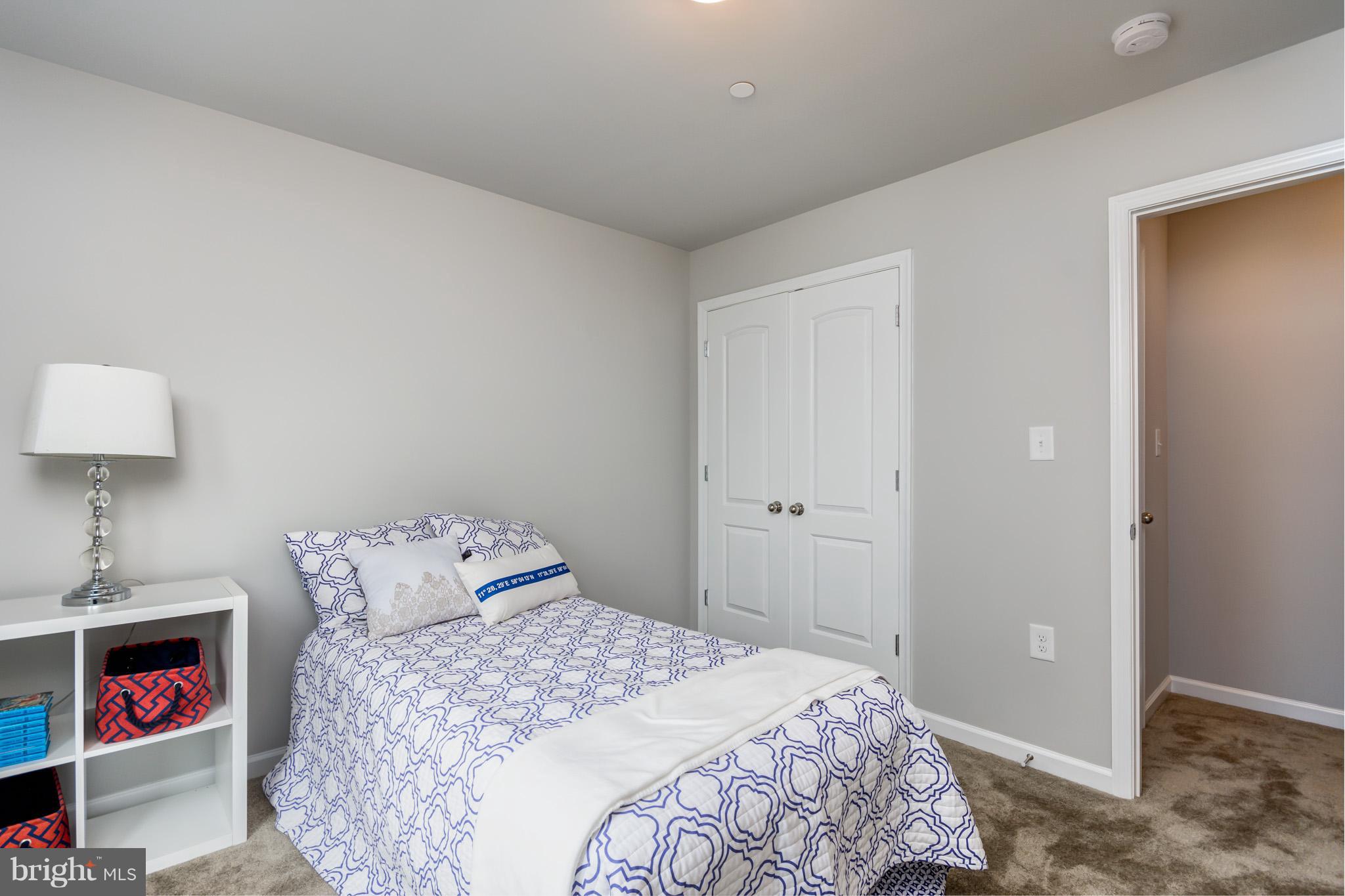 8035 Clark Station Road Severn, MD 21144 - Photo 23 of 24 a bedroom with a bed and a window