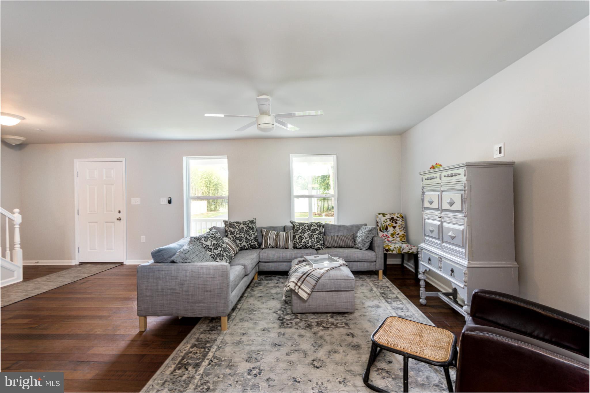 8035 Clark Station Road Severn, MD 21144 - Photo 4 of 24 a living room with furniture and a window