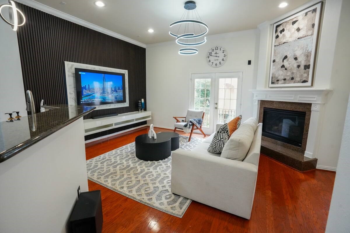 5625 Dolores Street, Unit B Houston, TX 77057 - Photo 1 of 40 a living room with furniture and a fireplace
