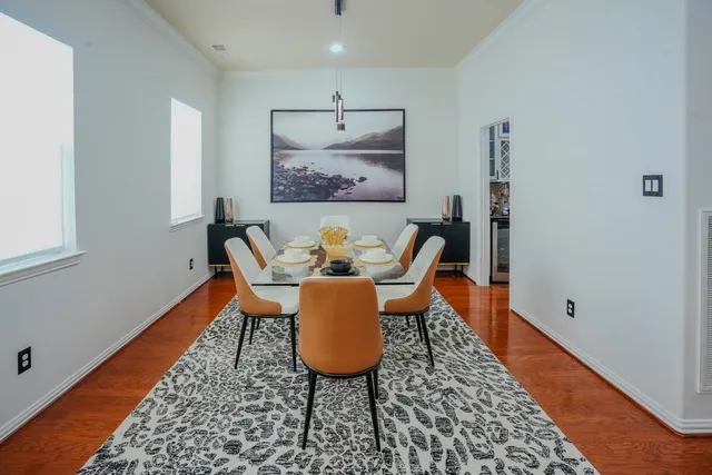a living room with furniture and a rug