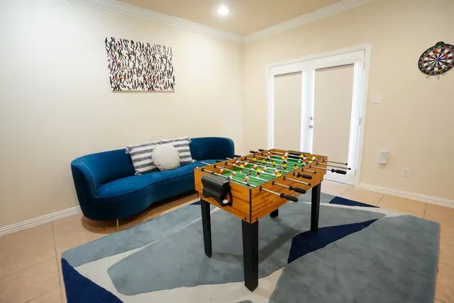 a living room with furniture and a rug