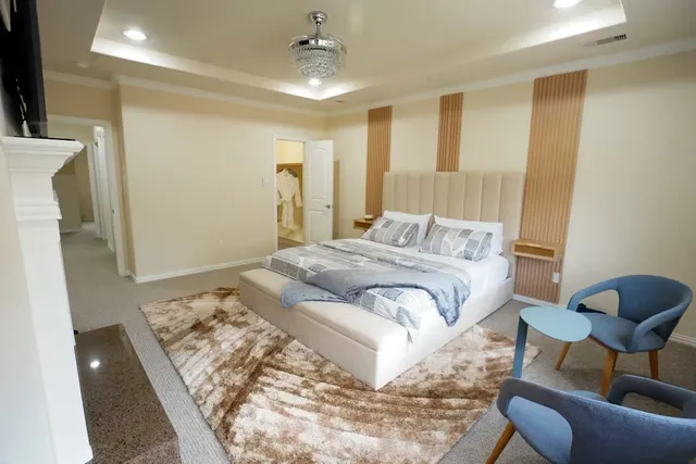 a bedroom with a bed and a chair