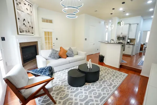 a living room with furniture and a fireplace