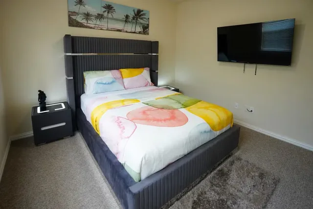 a bedroom with bed and window