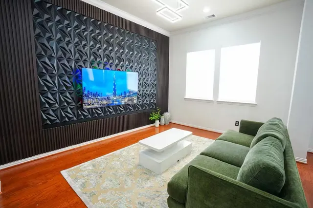 a living room with a couch and a rug