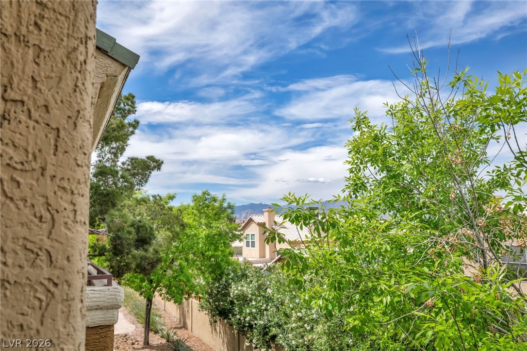 8070 West Russell Road, Unit 2060 Las Vegas, NV 89113 - Photo 37 of 47 Enjoy scenic mountain views from this elevated vantage point, showcasing lush greenery and distant architecture.