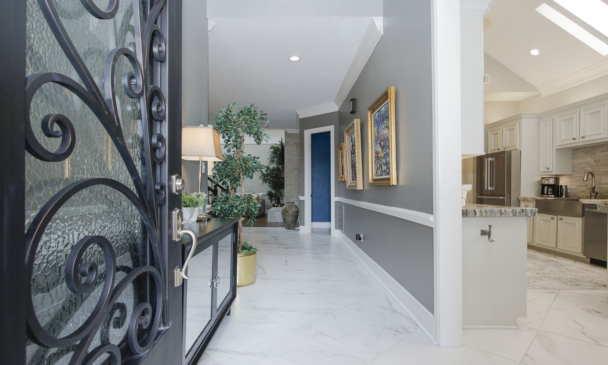 16610 Manningtree Lane Spring, TX 77379 - Photo 6 of 50 Impressive entry with 24" x 24" marble look porcelain tile.